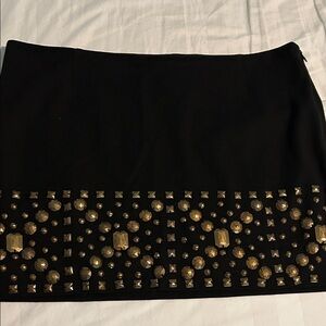Designer mini skirt with zip side. La RoK designer with metal grommets. Stitched